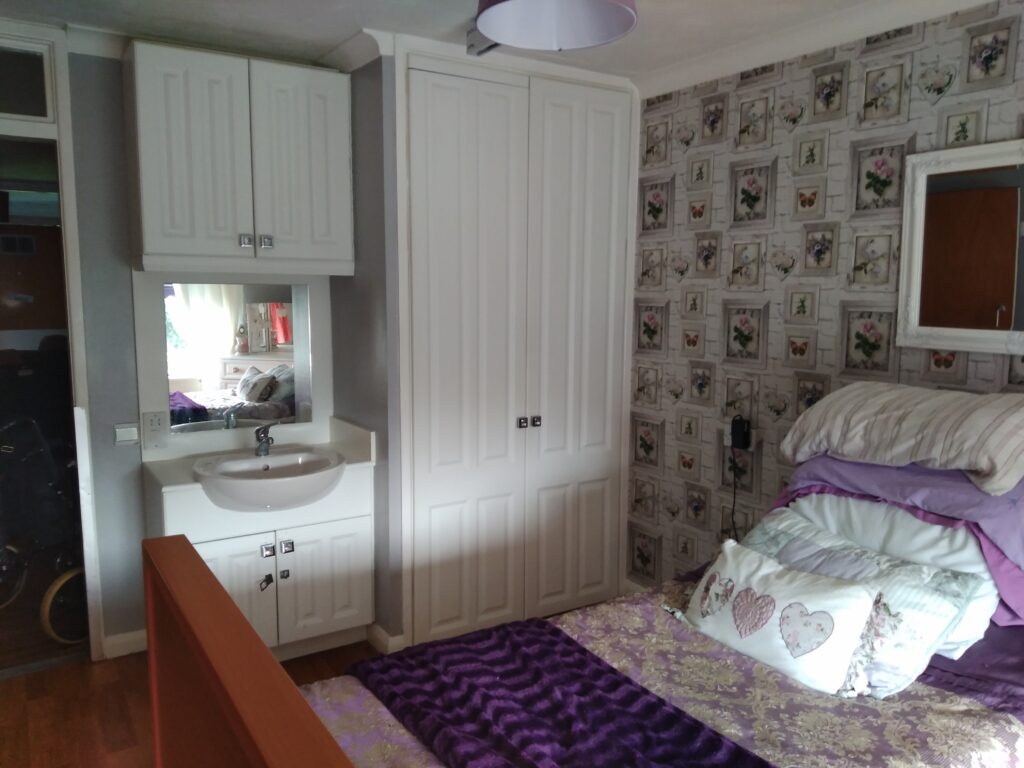 Floral wallpapered Bedroom in Edward Street House