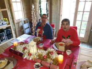 Westgate individuals sitting down at table to eat Christmas dinner