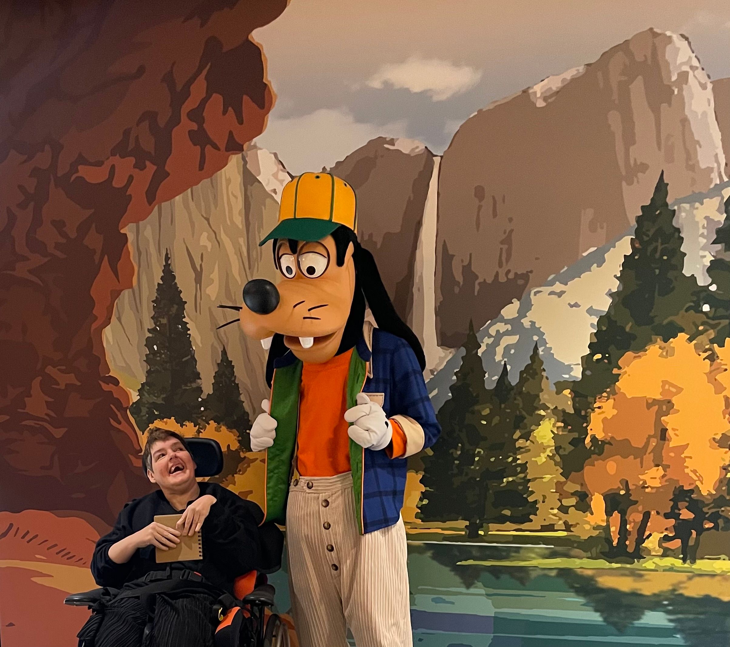 Debbie from Roman House meeting Pluto on a trip to Disneyland Paris