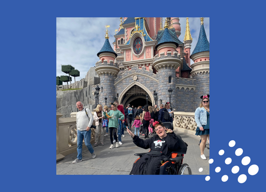 Debbie from Roman House pictured at the Disney castle on a trip to Disneyland Paris